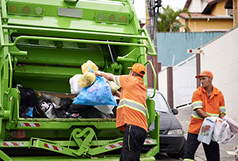 Close-up of filled rubbish bags being handled