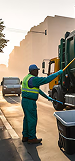 Waste truck parked in an urban lane